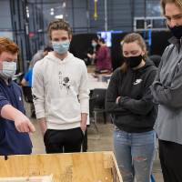 Students discuss their robot's movements